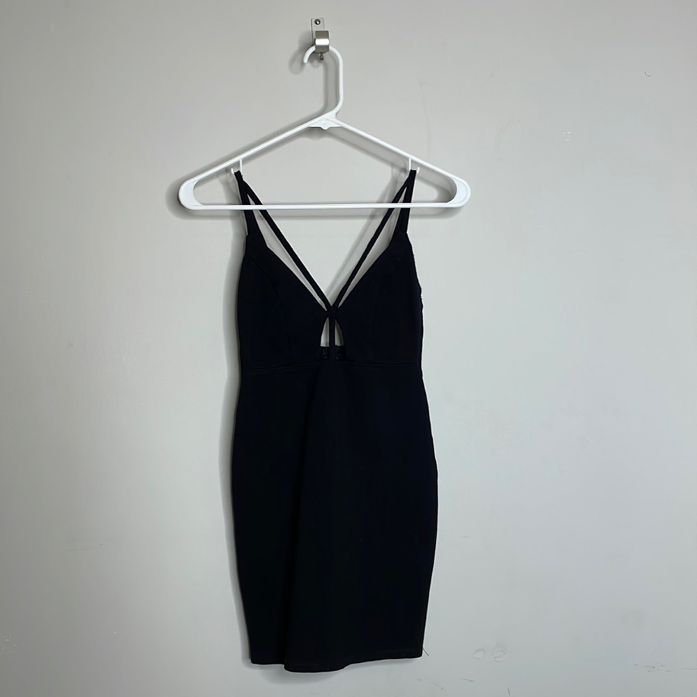 Black minidress with strapy details.So cute on and hugs in all the right places.